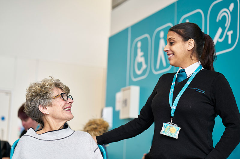 Image showing Special Assistance host at London Gatwick helping customer