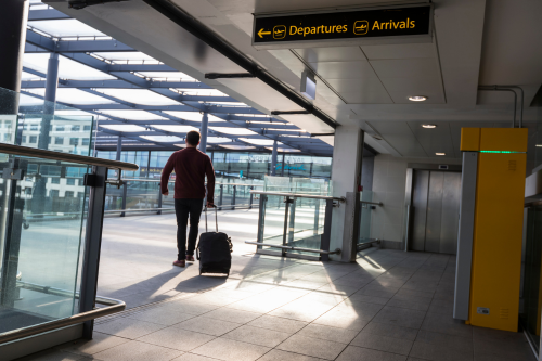 A passenger walking to North Terminal from Mid Stay Parking