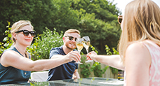 Image showing friends enjoying wine tasting in a vineyard