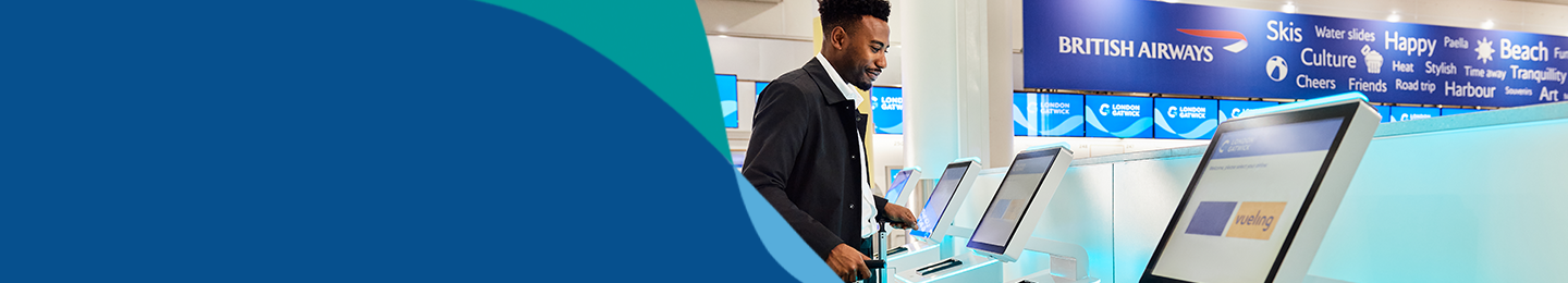 Banner image showing passenger using self-check in terminal at London Gatwick