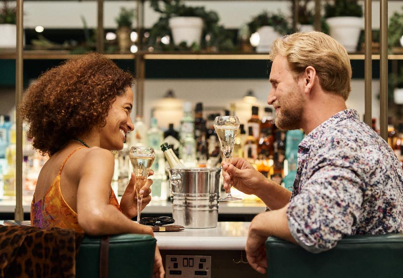 Image showing couple enjoying some celebratory champagne at Juniper in London Gatwick North Terminal