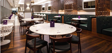 Seats at a table in a Gatwick Airport North Terminal lounge