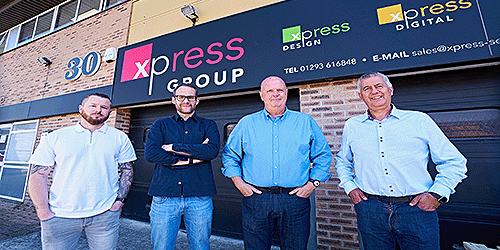 image of xpress printing group staff stood outside of their shop