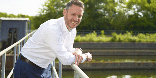 profile photo of Aaron Willmott leaning against a railing at a LGW water treatment lagoon