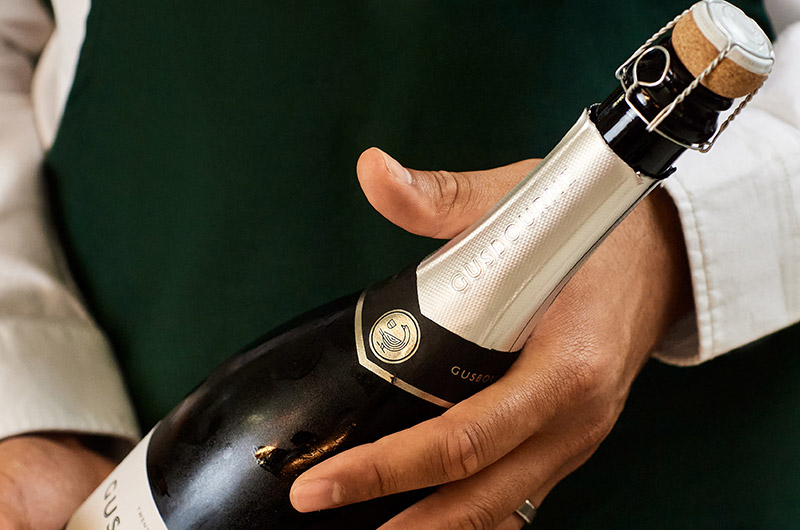 Bottle of English Sparkling wine on show for travellers to enjoy