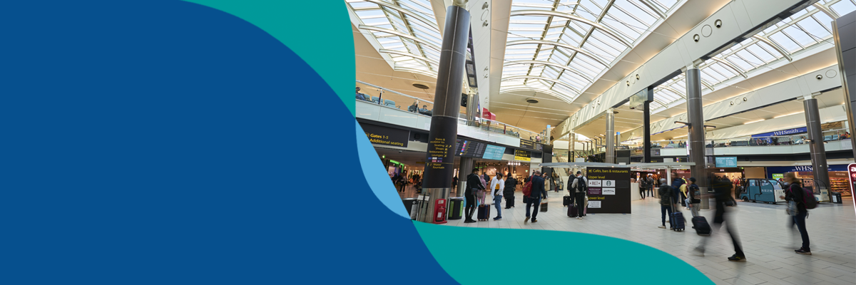 Banner image showing Special Assistance team member handing sunflower lanyard to passenger