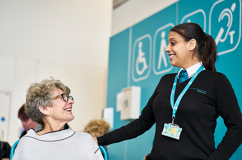 Image showing Special Assistance host at London Gatwick helping customer